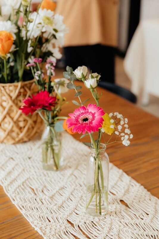 pink flowers in vases